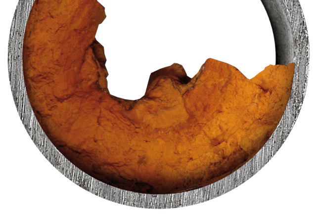 mineral scale buildup in water pipe white